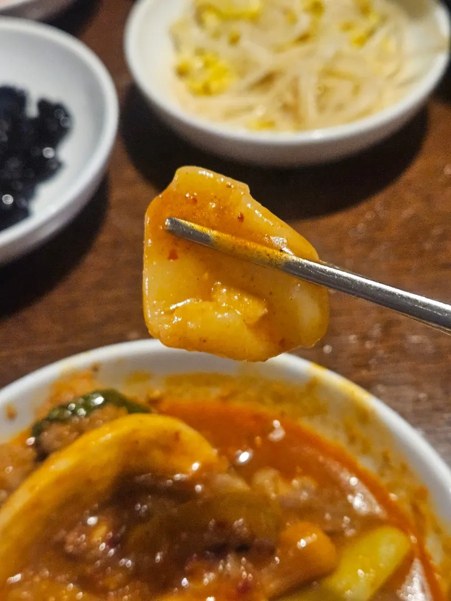 Glass noodles and mushrooms lifted from the tripe hot pot