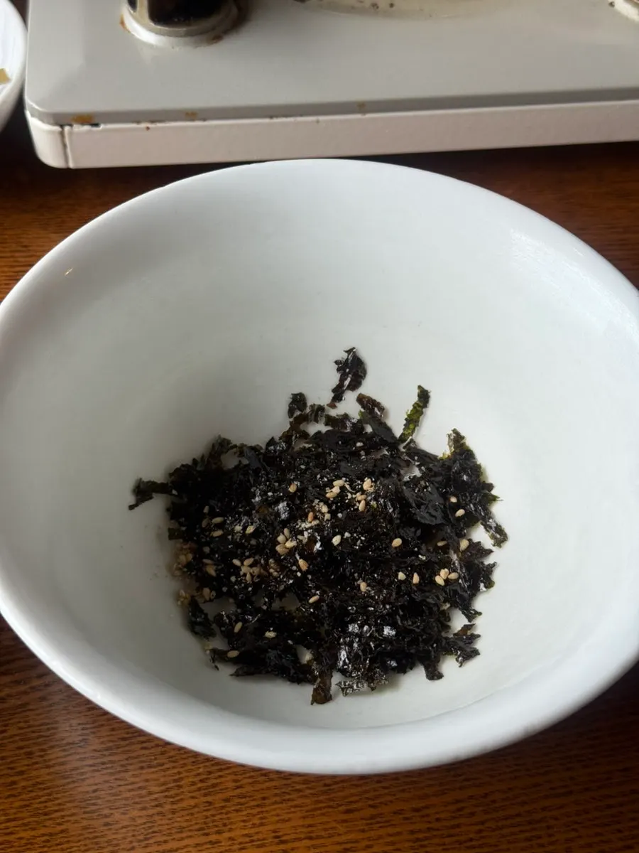 Bowl of rice with seaweed flakes