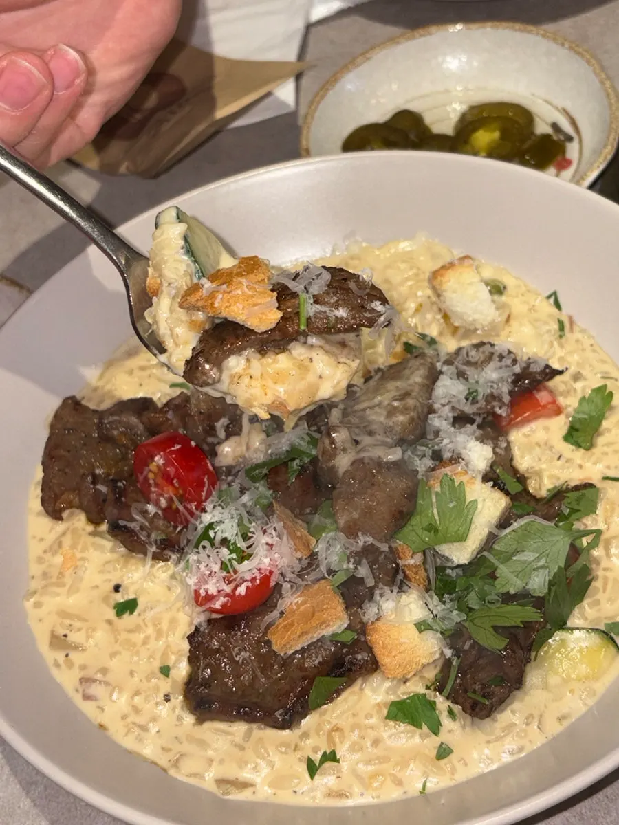 A spoonful of cheese-pull cream risotto
