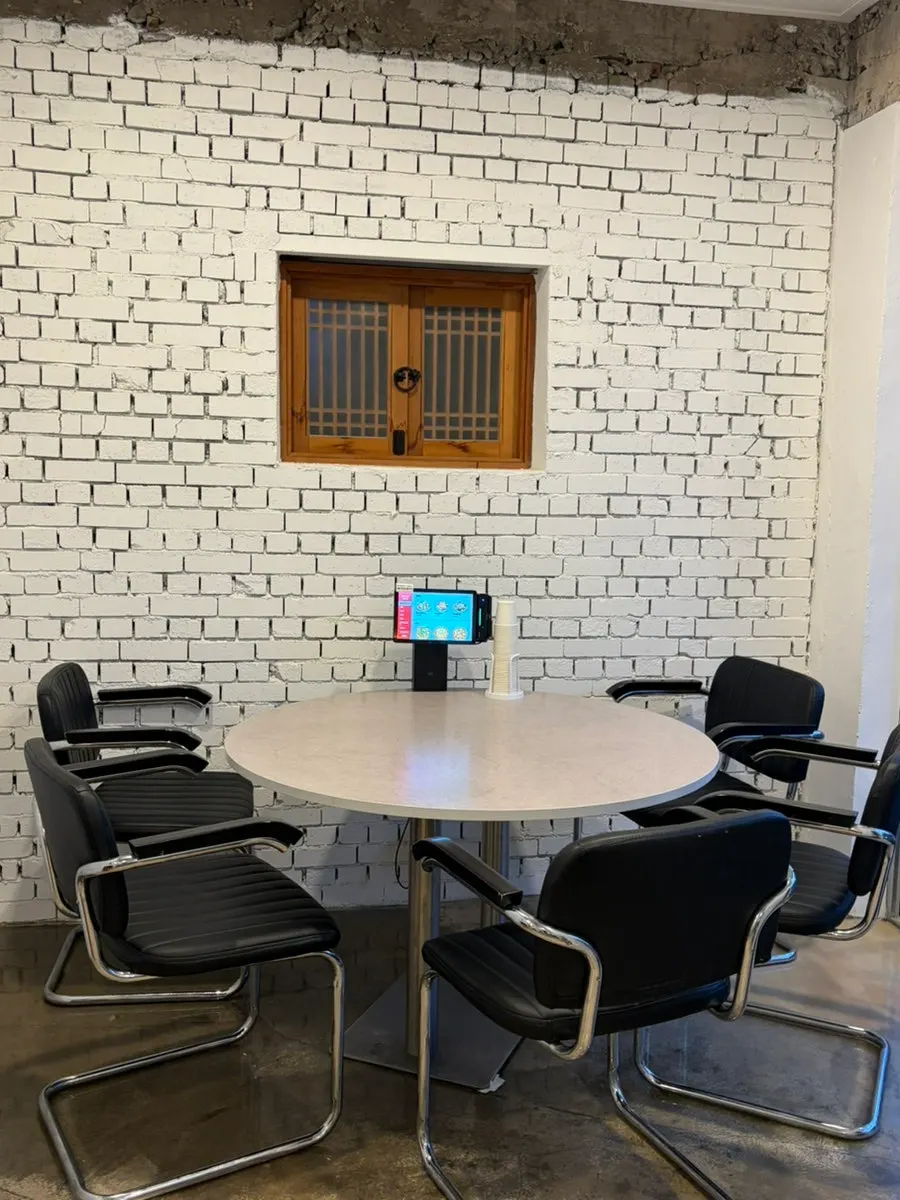 Reserved seating at Midam Kitchen with a large window