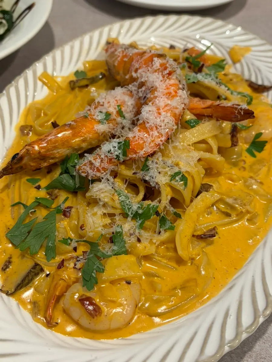 Midam Kitchen's Toowoomba pasta topped with two shrimp