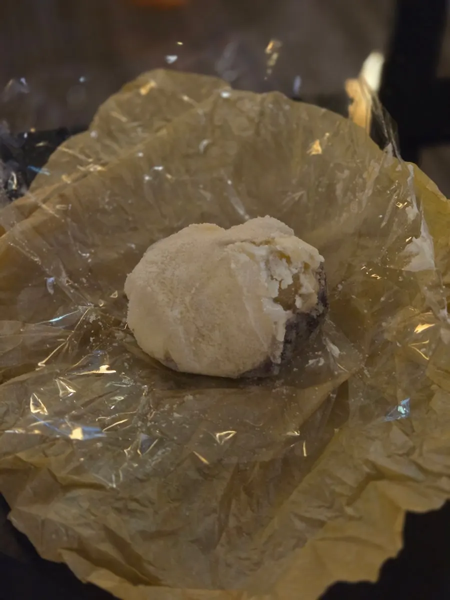 Cross-section of gold kiwi mochi showing whole kiwi inside
