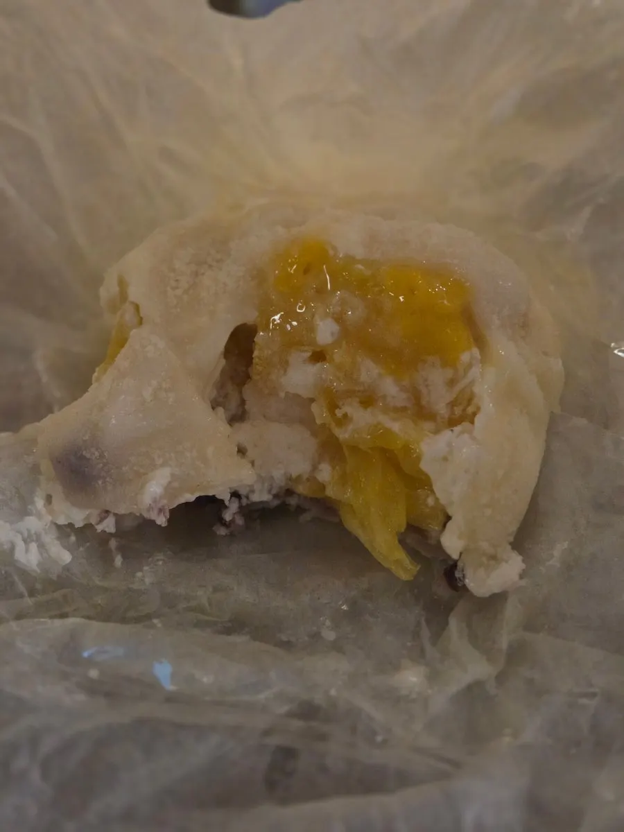 Thin, chewy rice cake skin of the pineapple mochi