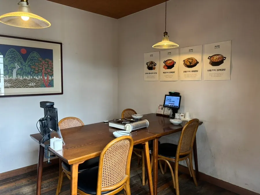 Table with a kiosk for ordering at Dongyang Baekban
