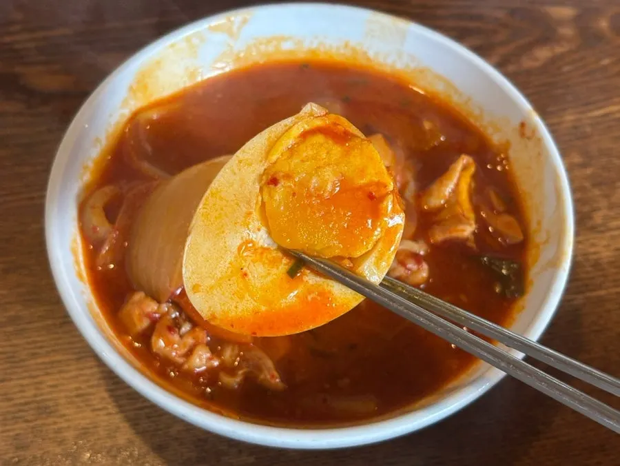 Spicy dakbokkeumtang broth at a boil