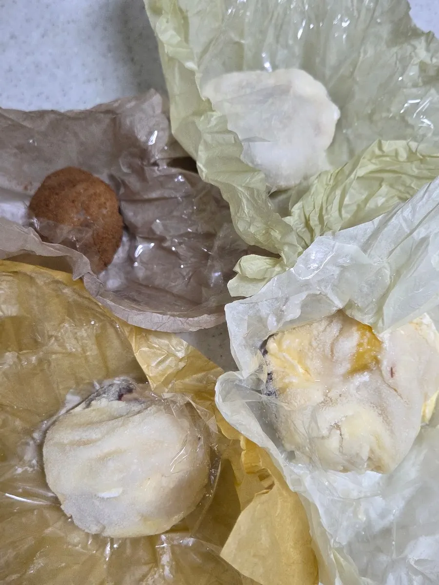 Tareudang fruit mochi shown fist-sized for scale