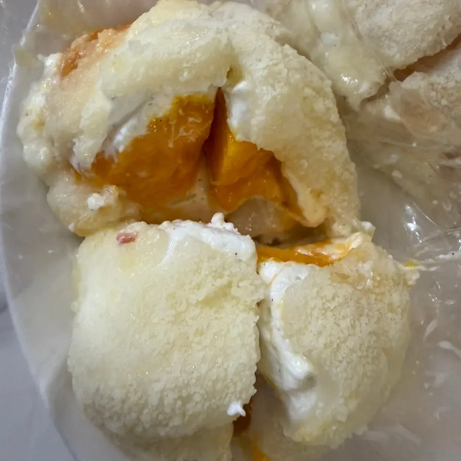 Cross-section of mango yogurt mochi with a large chunk of mango