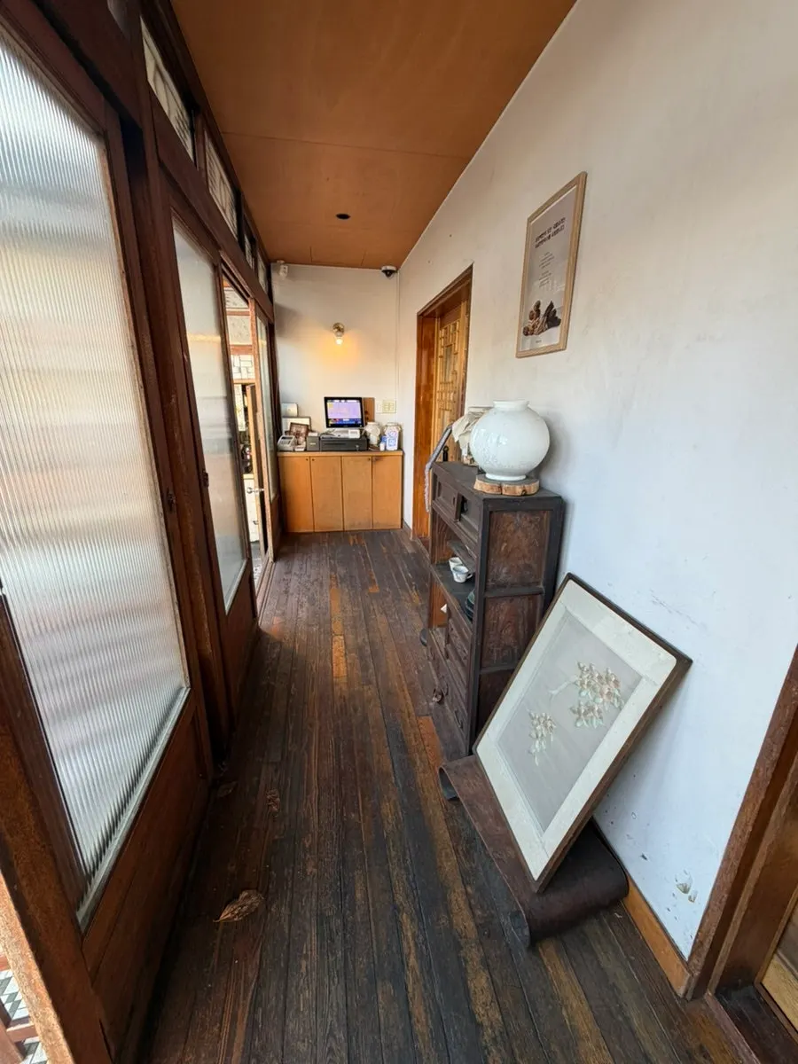 Seat with a view of the grass yard through the window