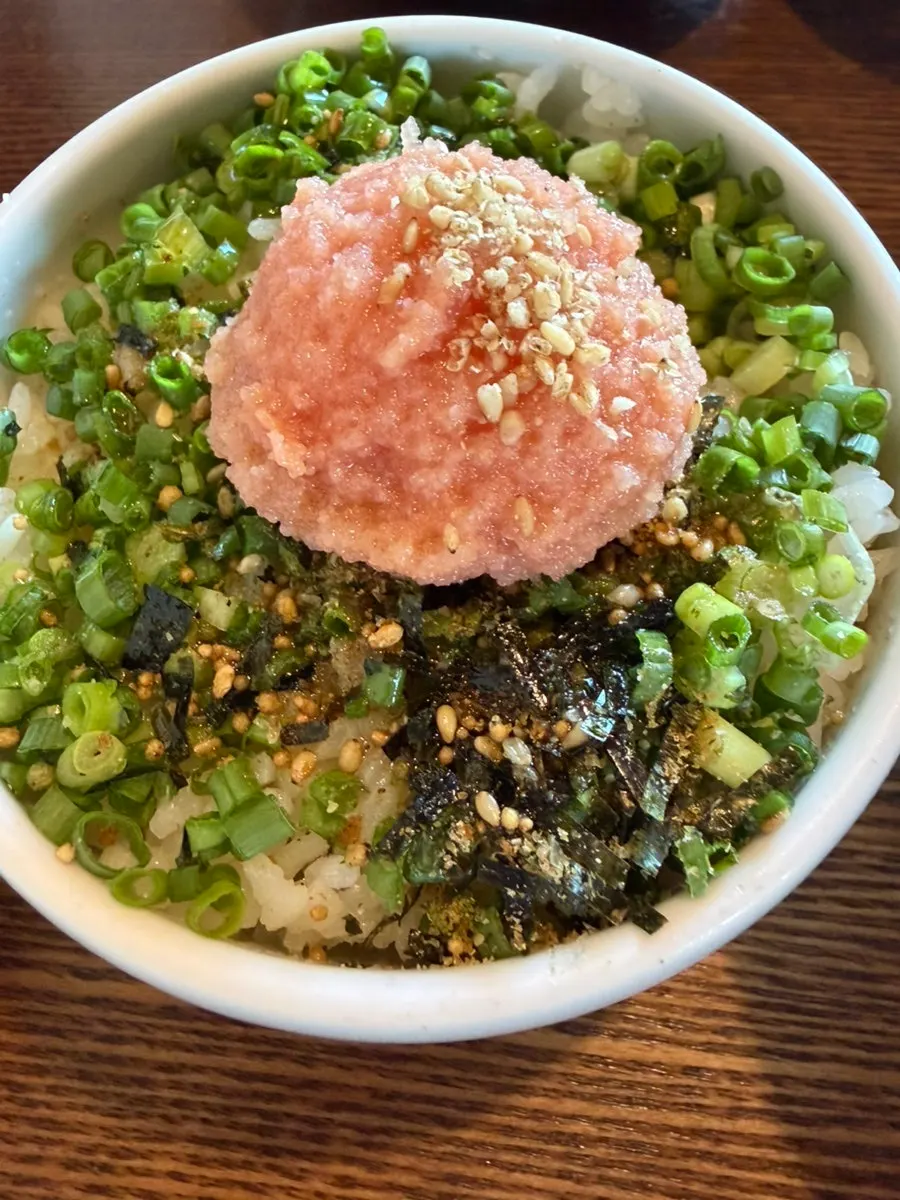 Mentaiko rice topped with gim flakes and sesame seeds