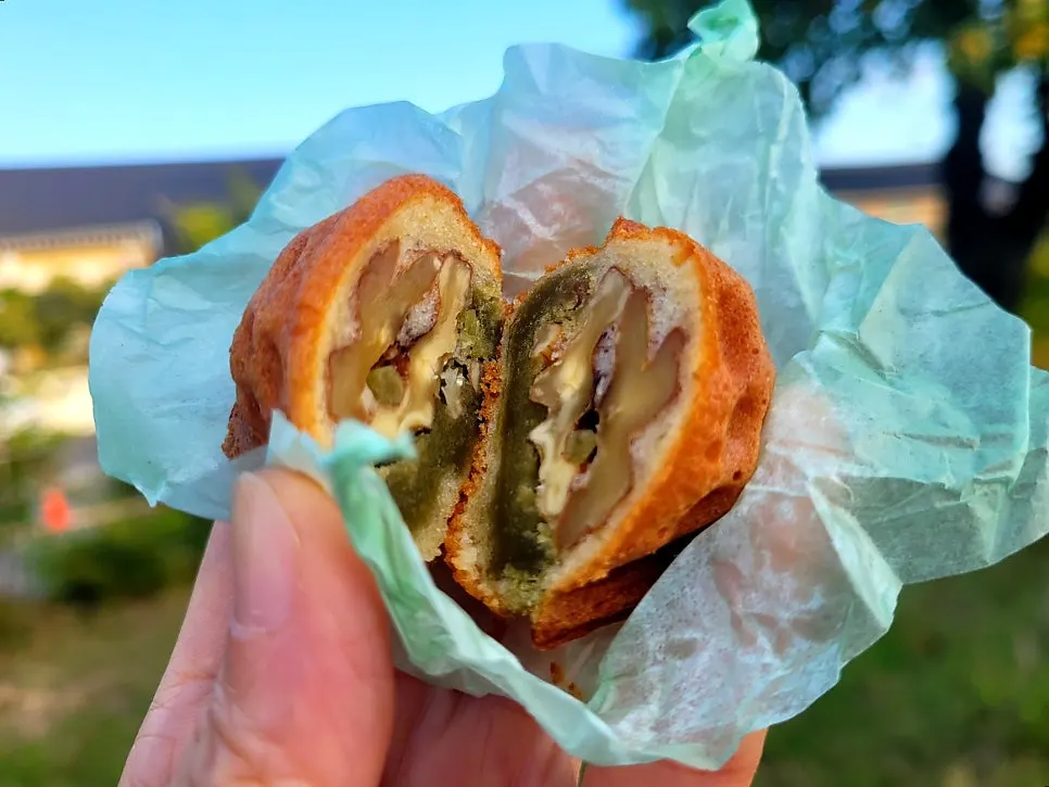 Cross-section of walnut pastry with matcha filling