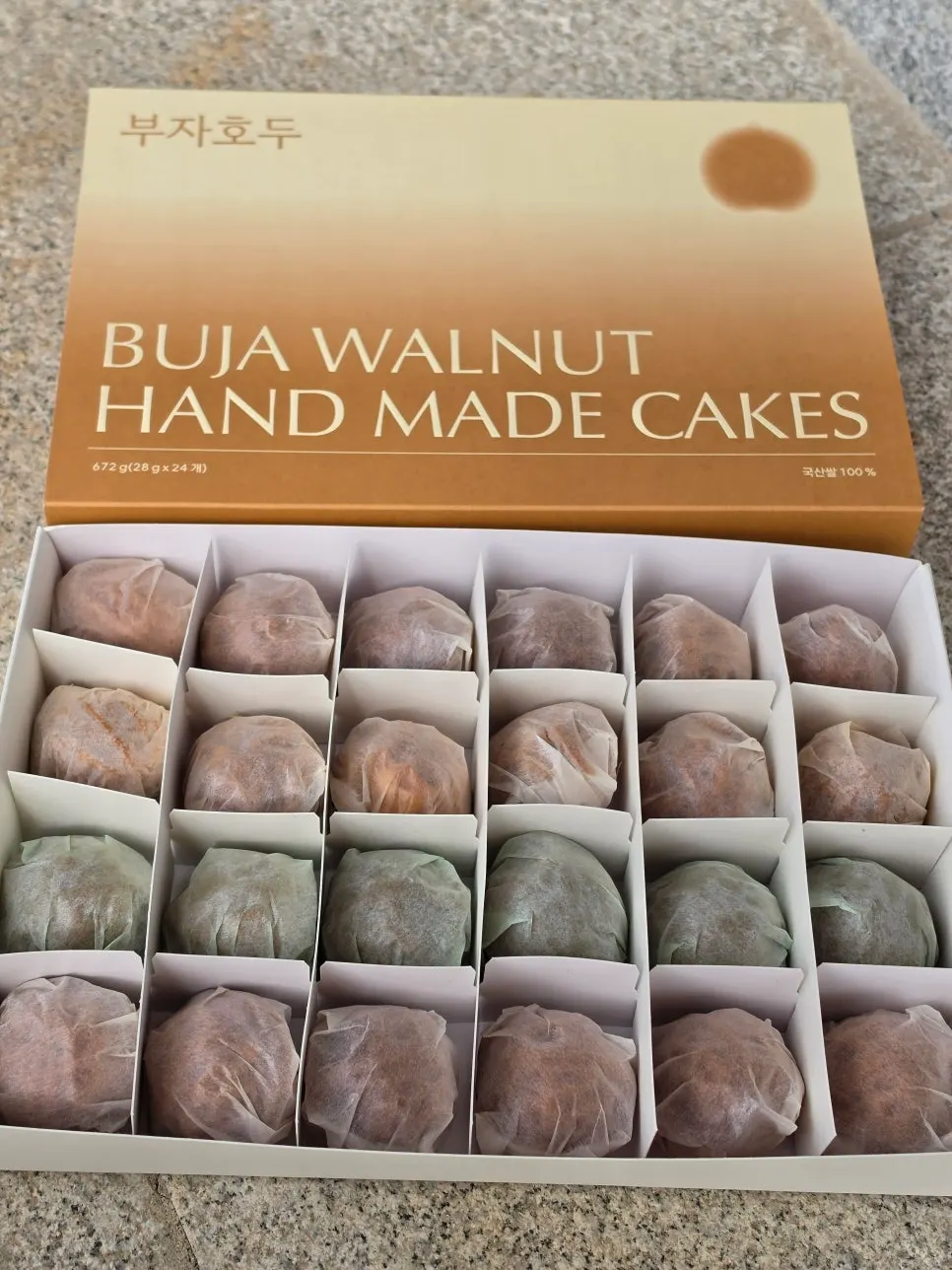 Walnut pastries neatly arranged in the gift box compartments