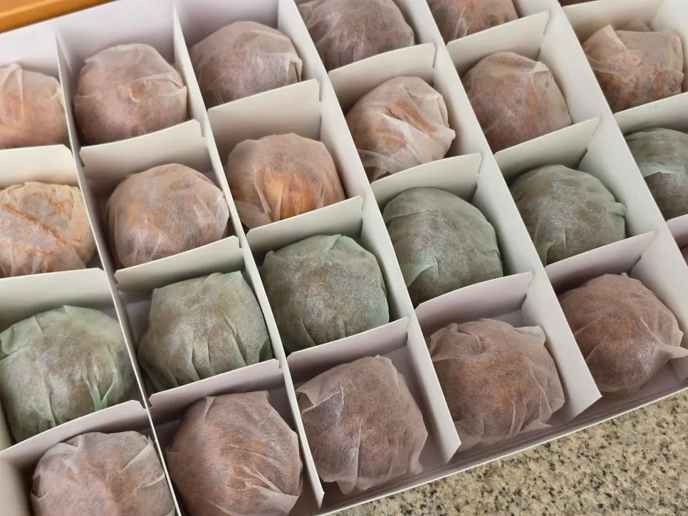 Walnut pastries individually wrapped in parchment paper