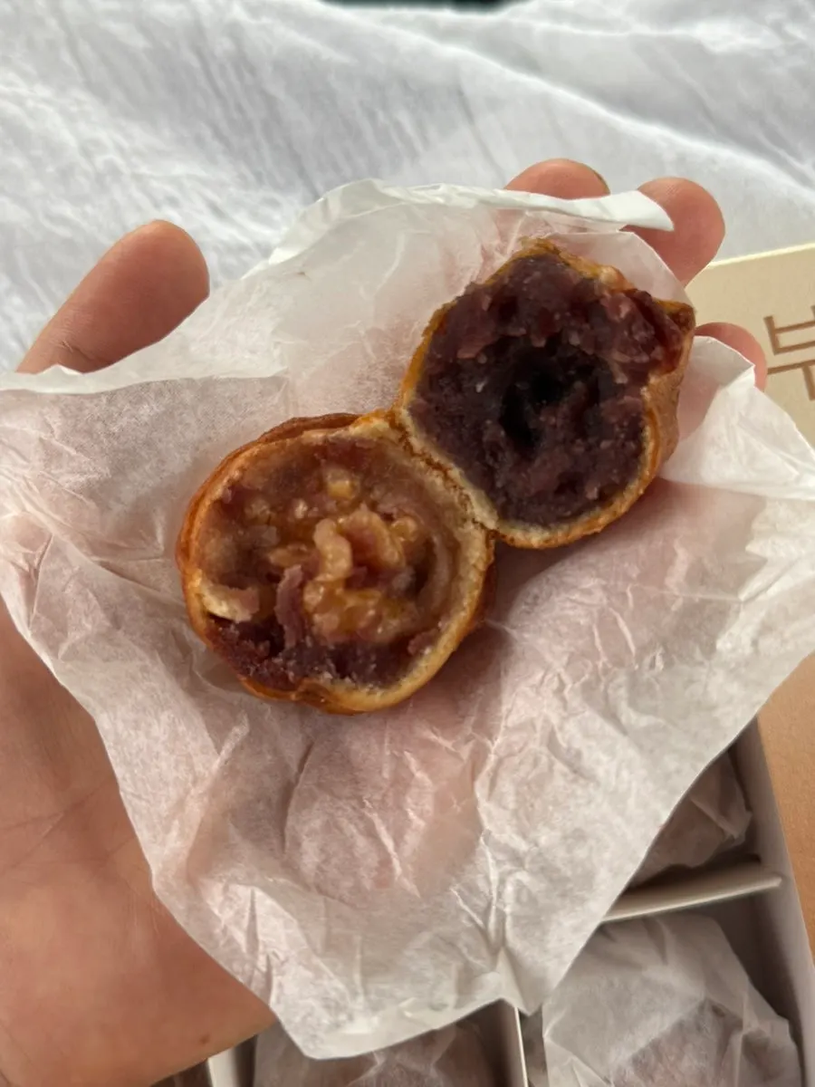 Cross-section of a walnut pastry with a whole walnut inside