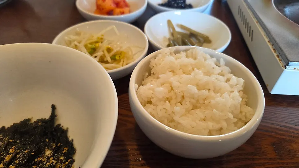 Garlic scapes, braised soybeans, and other banchan