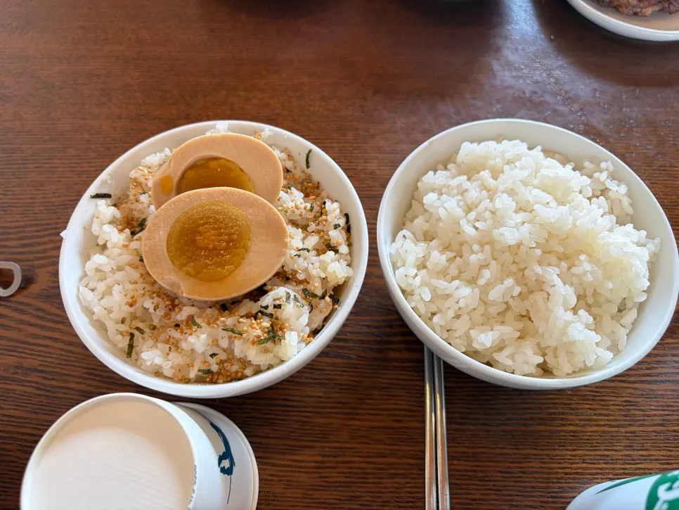 Dongyang Baekban's cheese tteokgalbi topped with melted cheese, served with rice