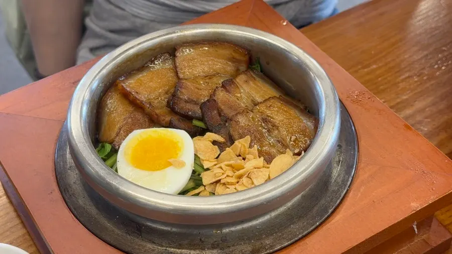 Pot rice topped with soy-braised whole pork belly