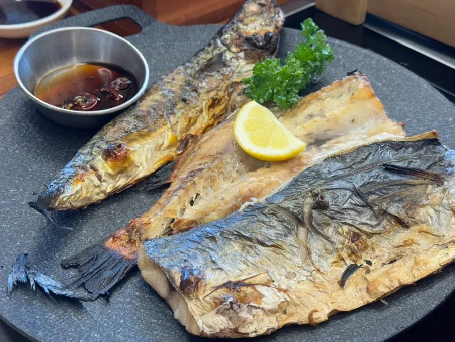 Full view of the wood-fired grilled fish set for two