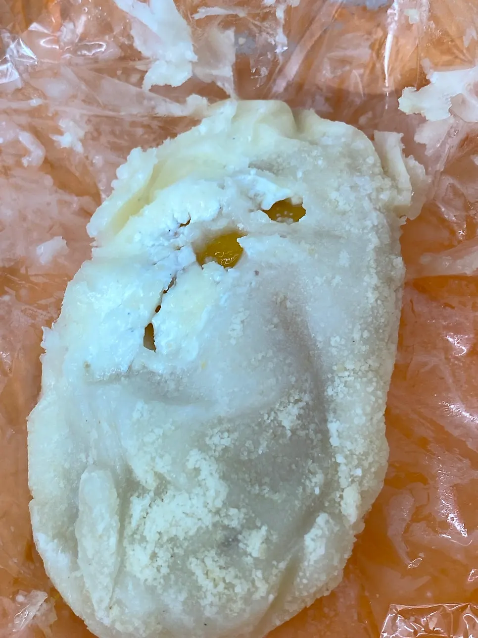 Mango mochi in orange wrapper
