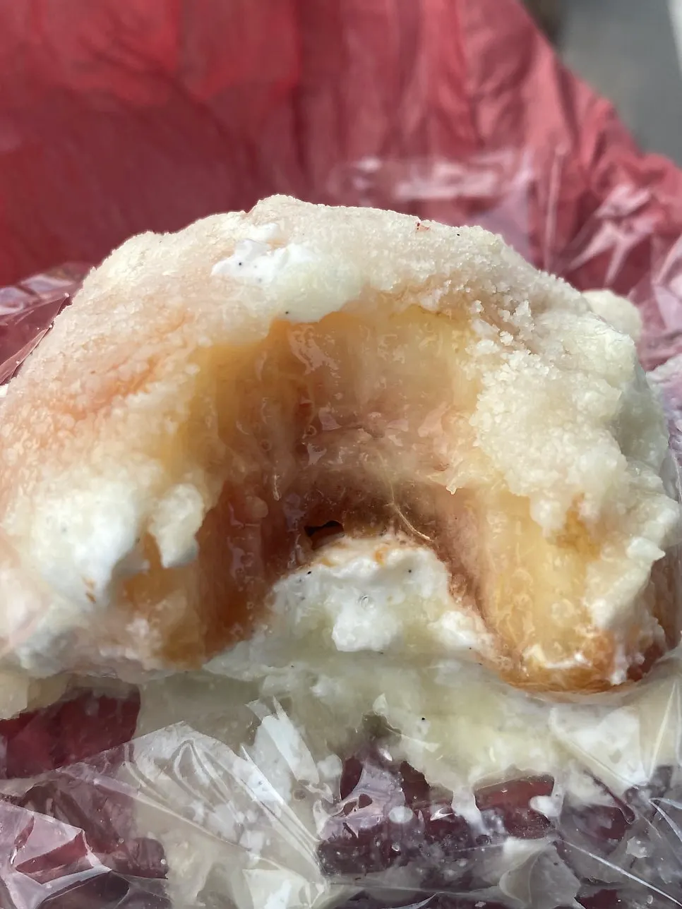 Cross-section of peach mochi dripping with juice