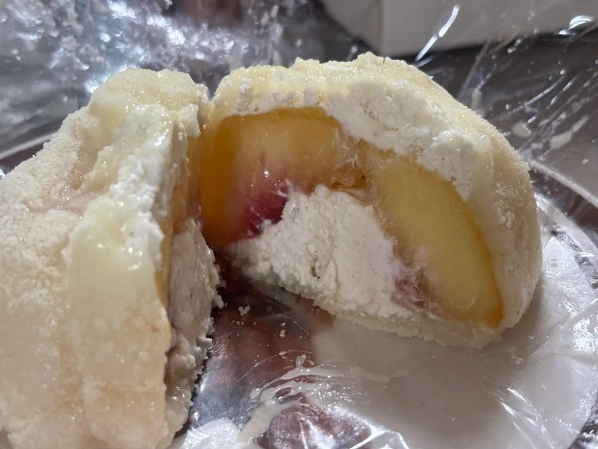 Kiwi, peach and mango mochi lined up together