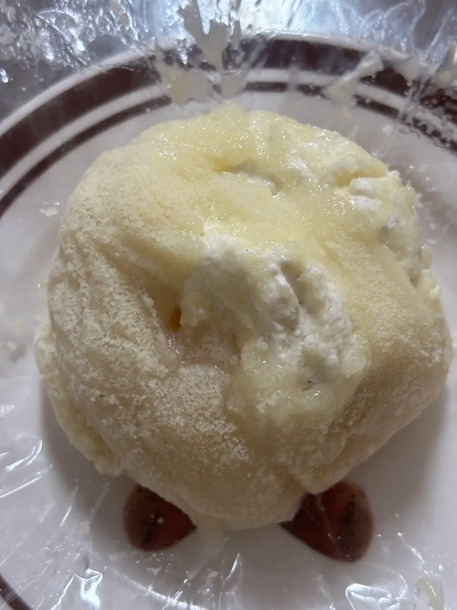 A large fruit mochi held in hand