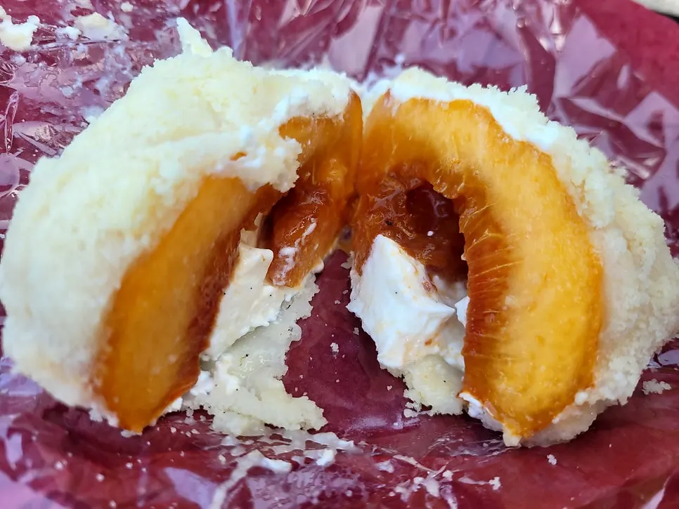 Cross-section of peach mochi with white peach inside