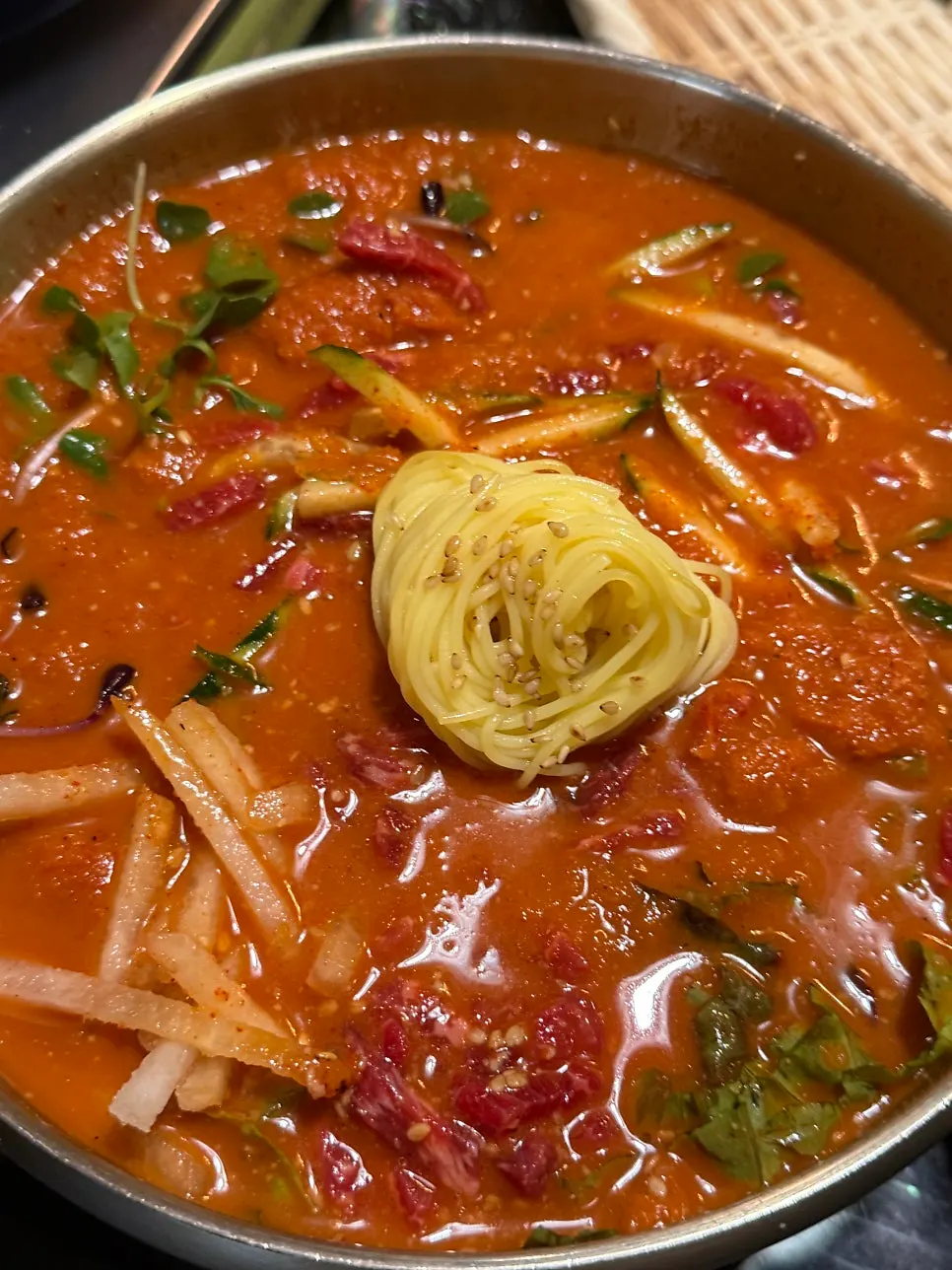Yukhoe mulhoe topped generously with raw beef