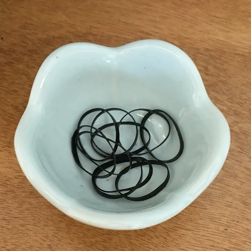 Hair ties placed on every table