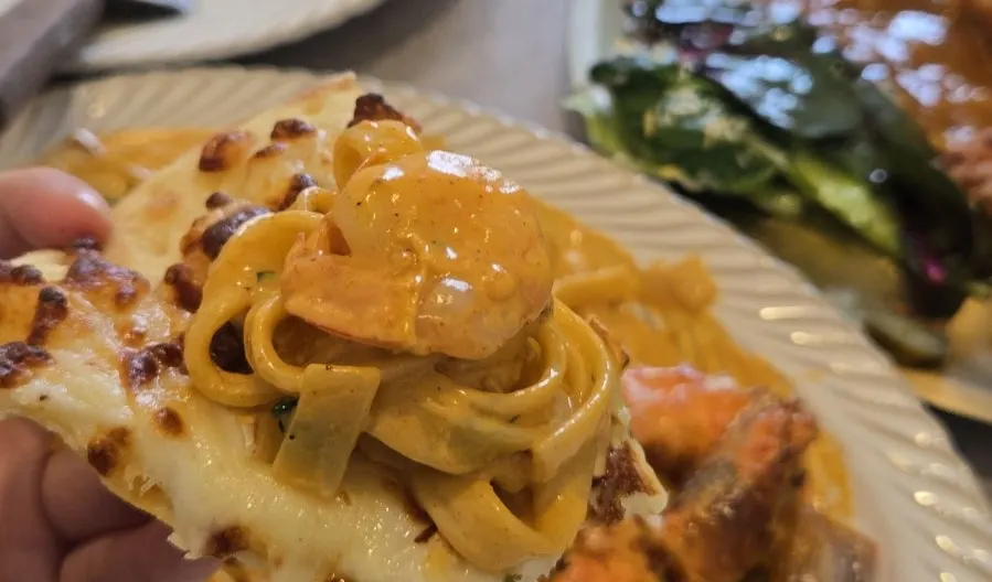 Toowoomba pasta piled on top of pizza