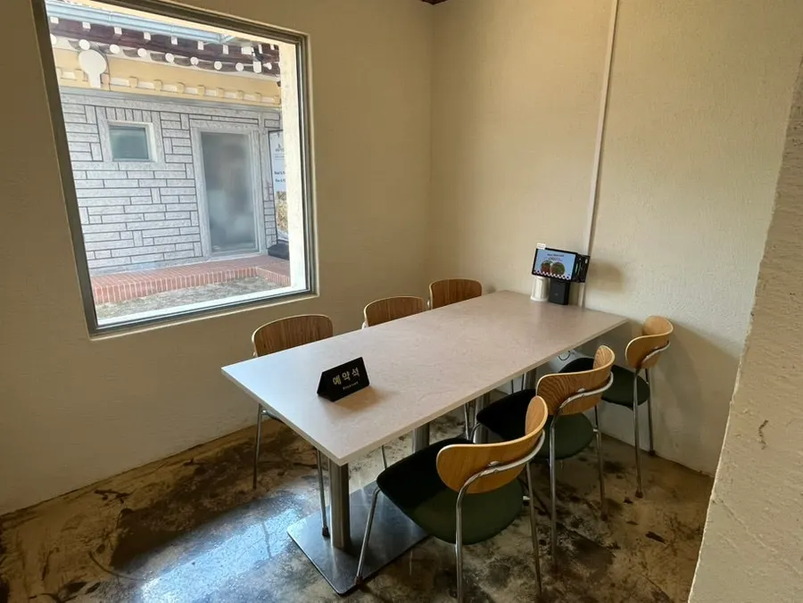 Table layout with separated seating areas at Midam Kitchen