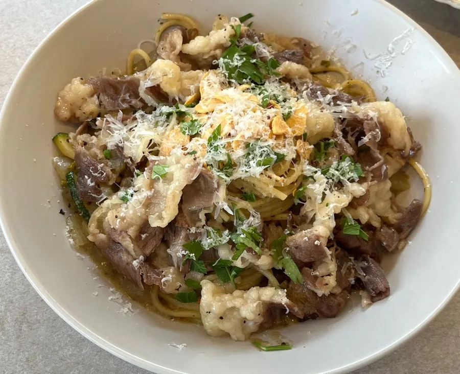 Beef brisket oil pasta piled generously with brisket
