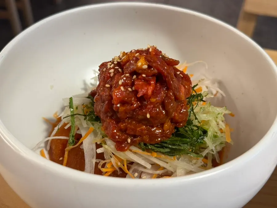 Table spread with yukhoe mulhoe and buckwheat noodles