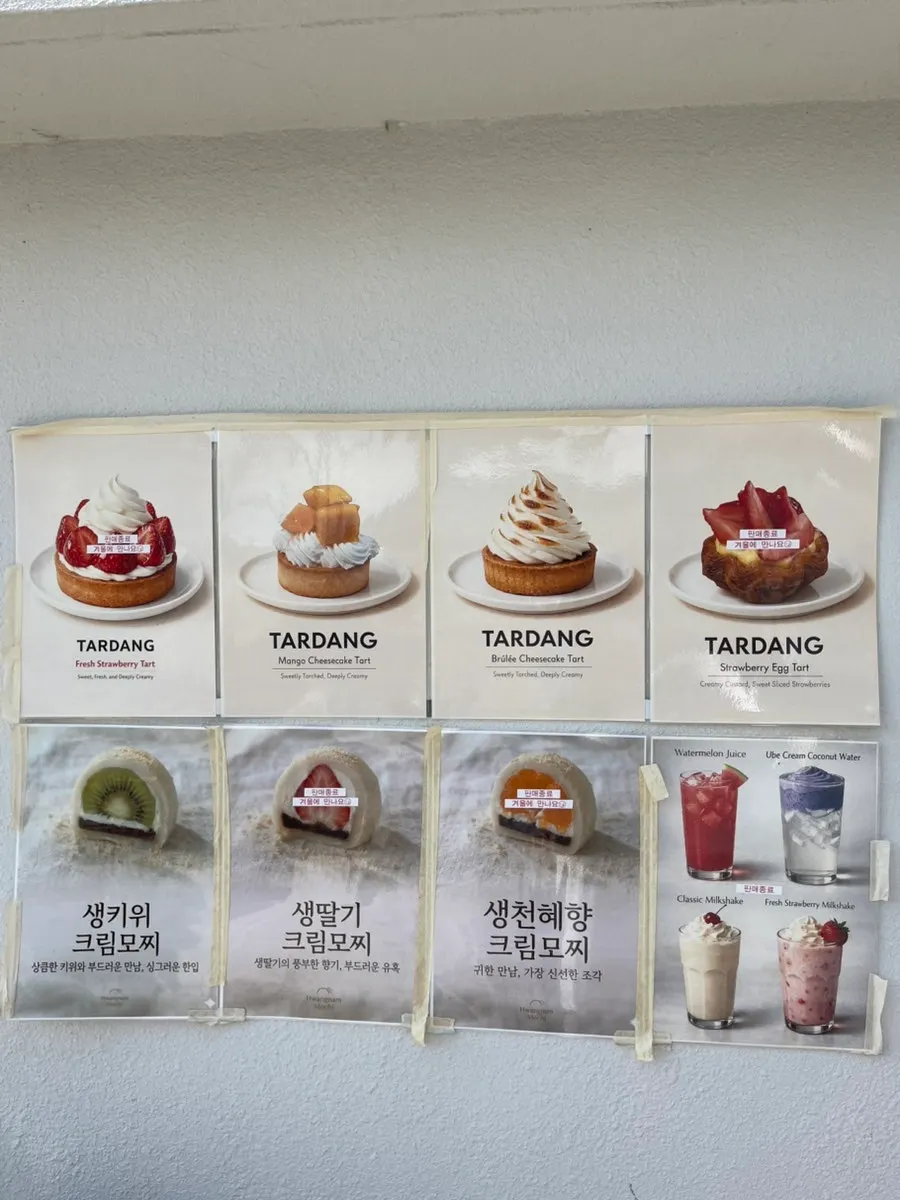 Tareudang menu board listing tarts and fruit mochi
