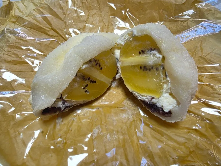 A round, plump gold kiwi mochi