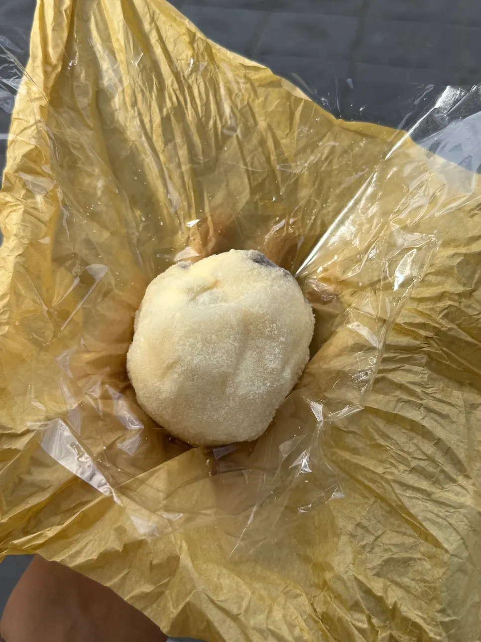 Gold kiwi mochi in yellow wrapping