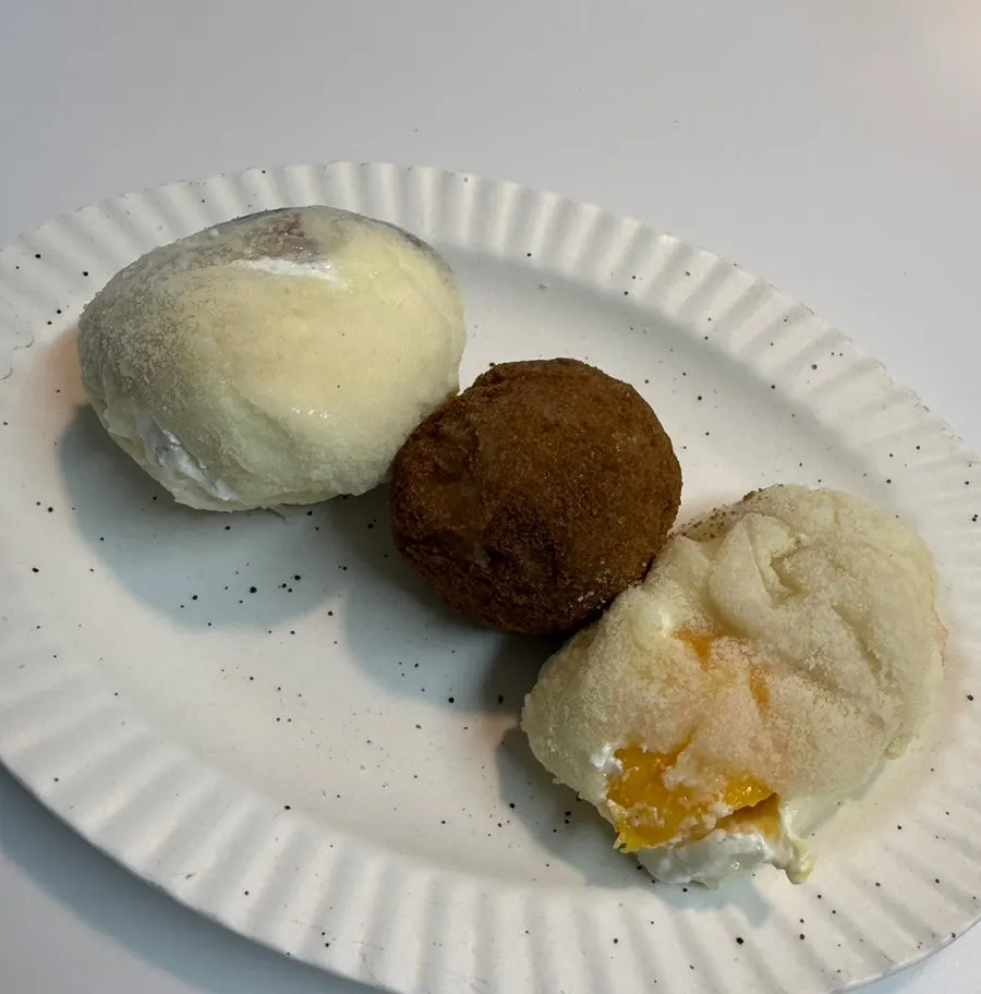 Mango, fig, and fresh chocolate mochi side by side