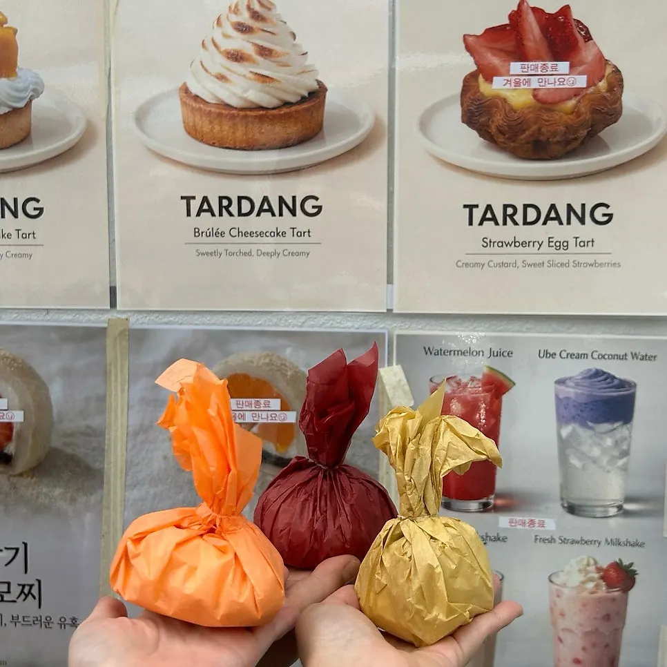 Three flavors of giant fruit mochi packed in a box