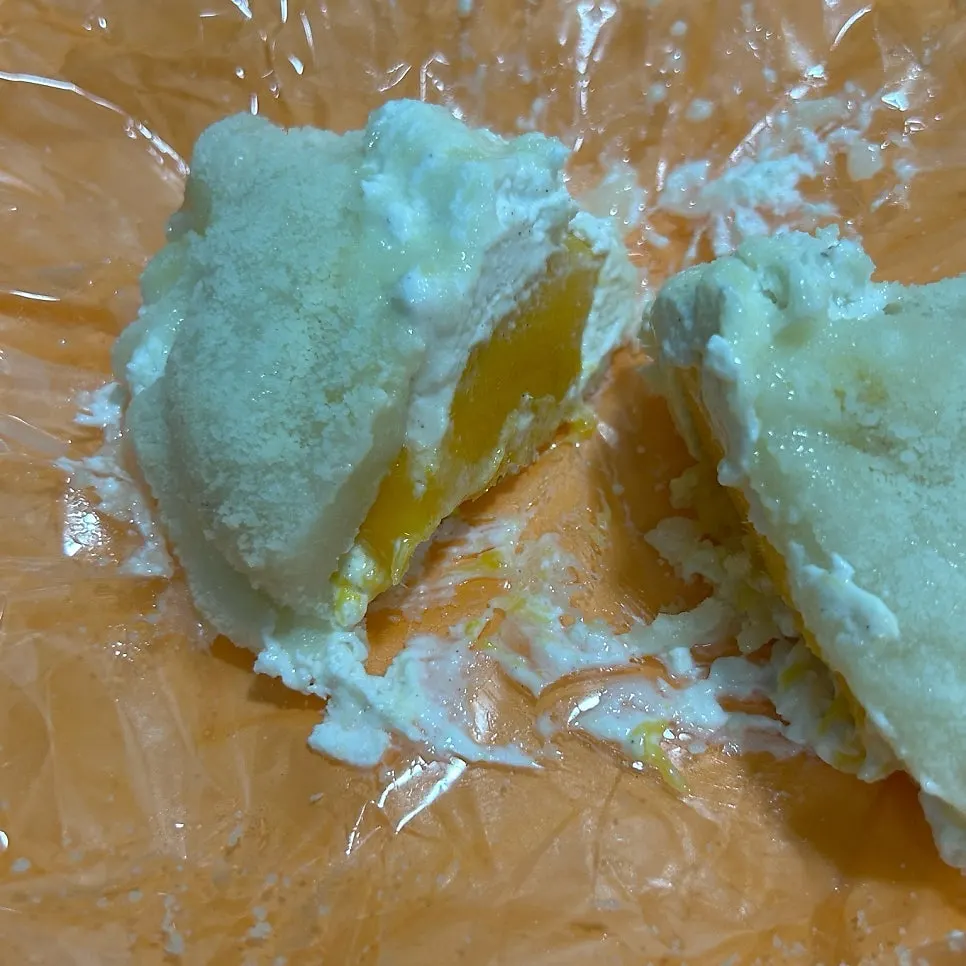 Cross-section of giant mochi full of yogurt cream and fruit