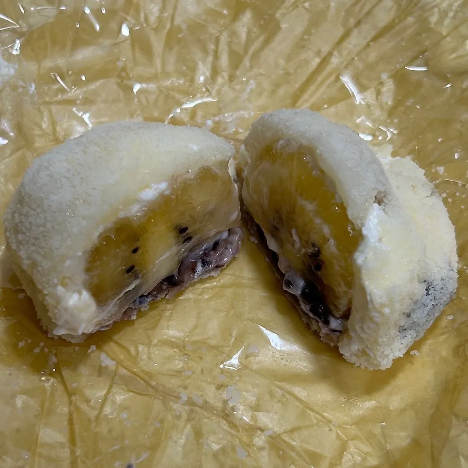 Cross-section of gold kiwi mochi with red bean filling