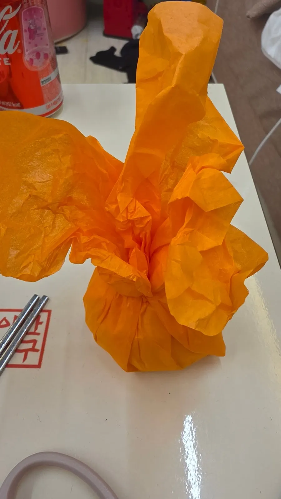Persimmon mochi wrapped in orange packaging