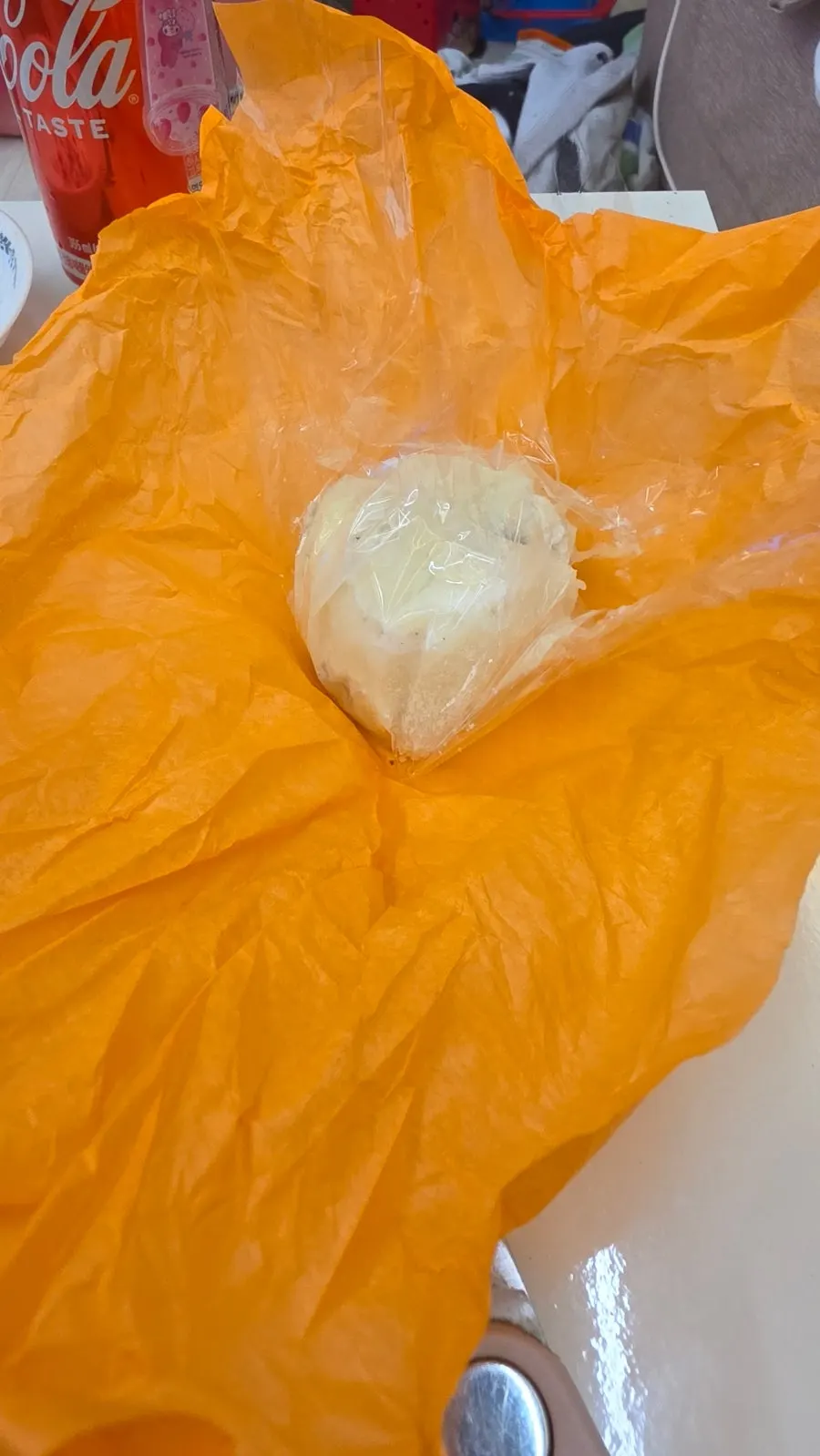 Persimmon mochi wrapped in clear plastic