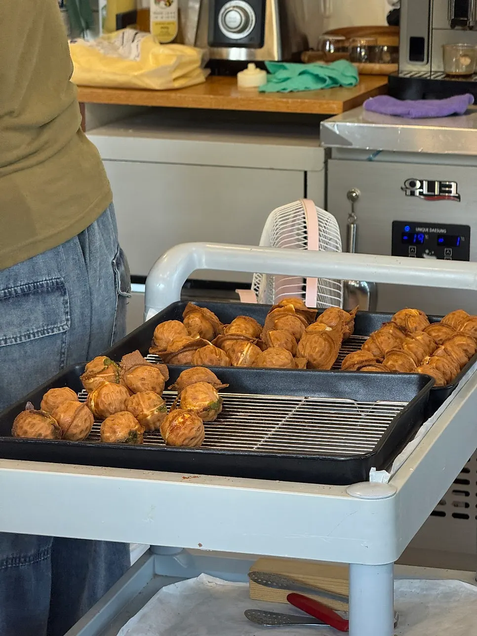 Machine baking walnut pastries at Buja Hodu