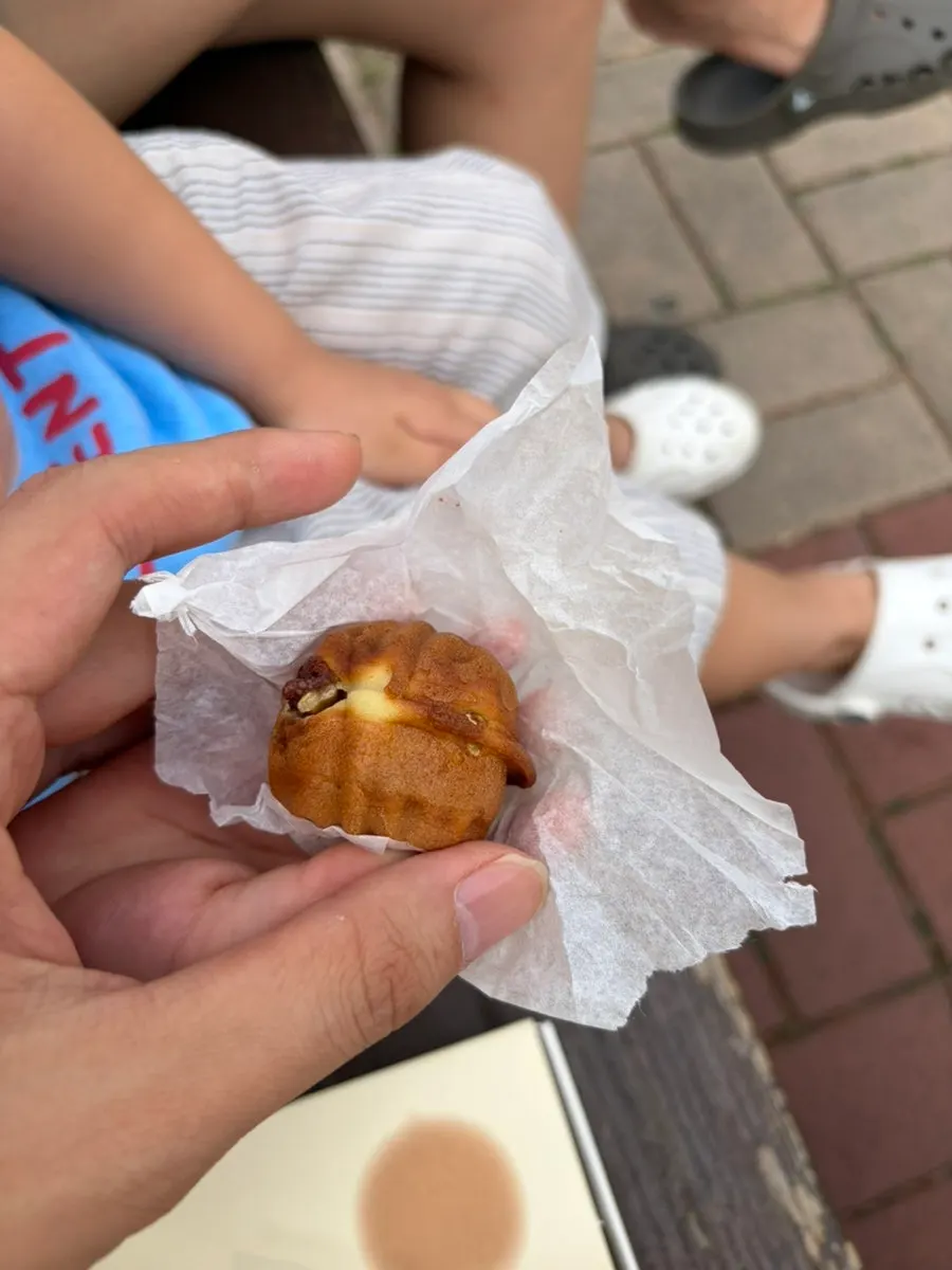 Walnut pastries individually wrapped in paper inside the box
