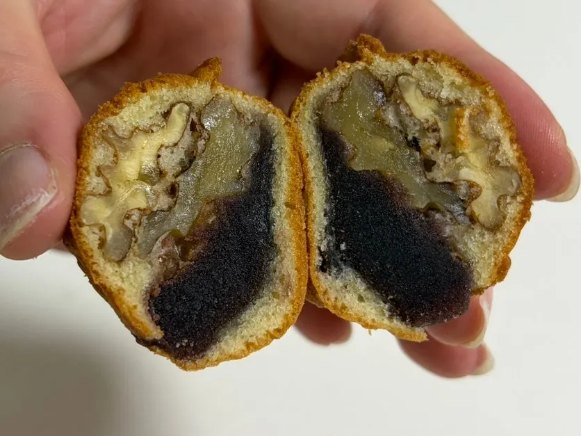 Cross-section of a walnut pastry with a whole walnut inside