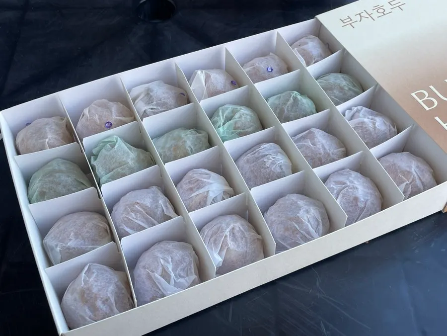 24 walnut pastries arranged in three flavors