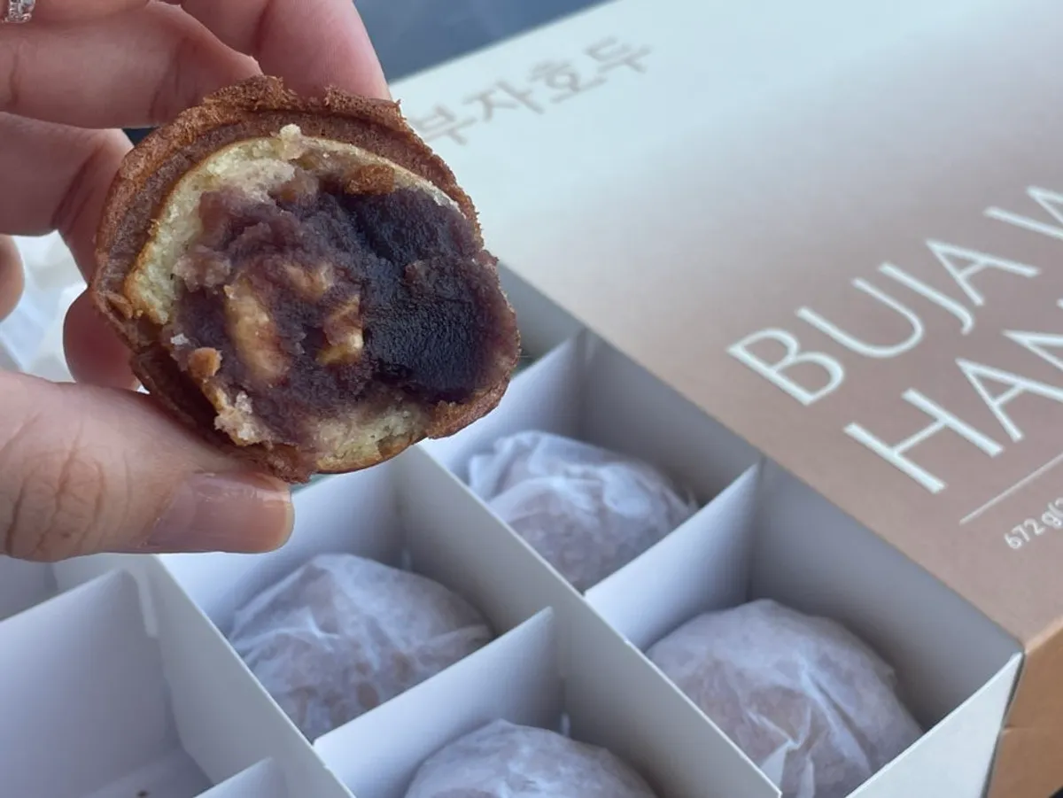 Walnut pastries placed alongside a packaged coffee