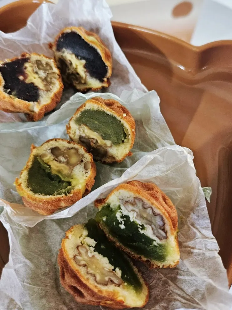 Cross-section of a walnut pastry with a whole walnut piece
