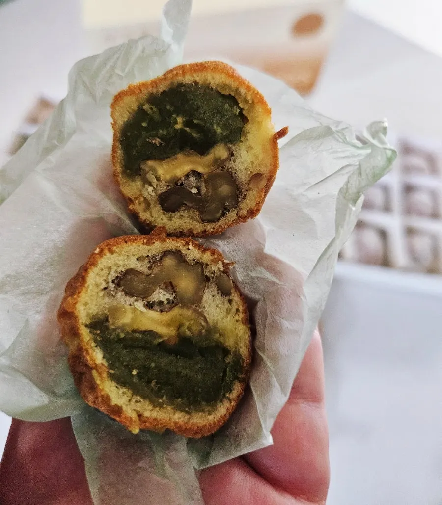 Eating walnut pastries as a snack on Hwangnidan-gil, Gyeongju