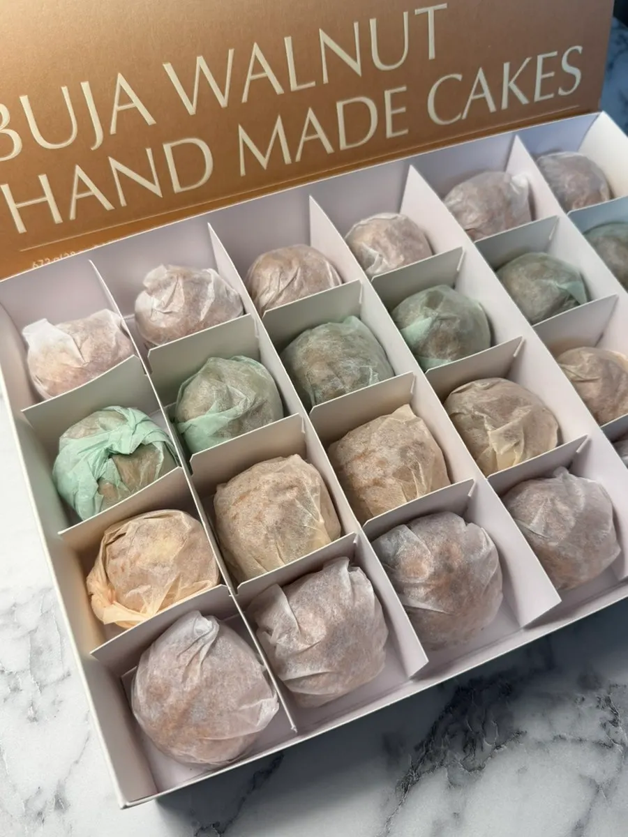 24-piece box of walnut pastries arranged by flavor