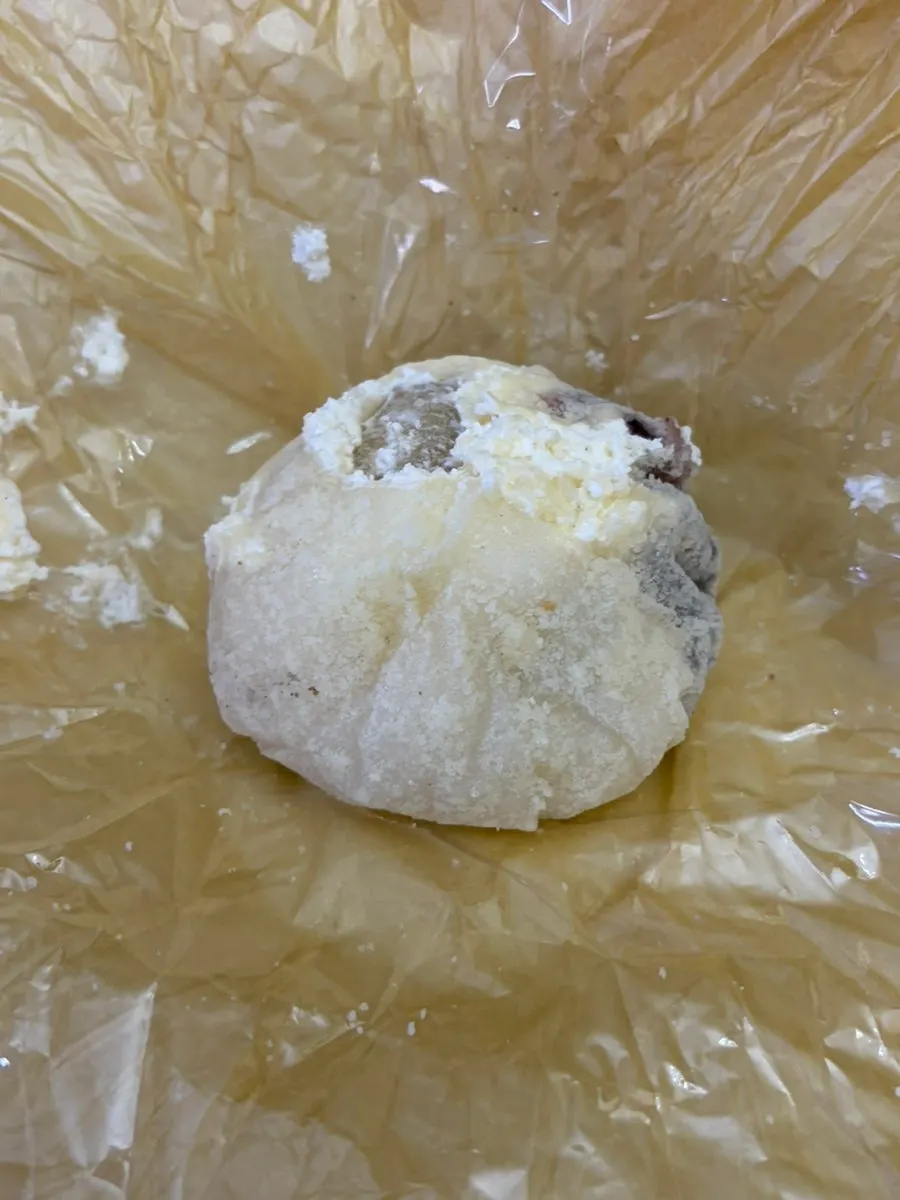Cross-section of a fruit mochi with a whole pineapple piece inside